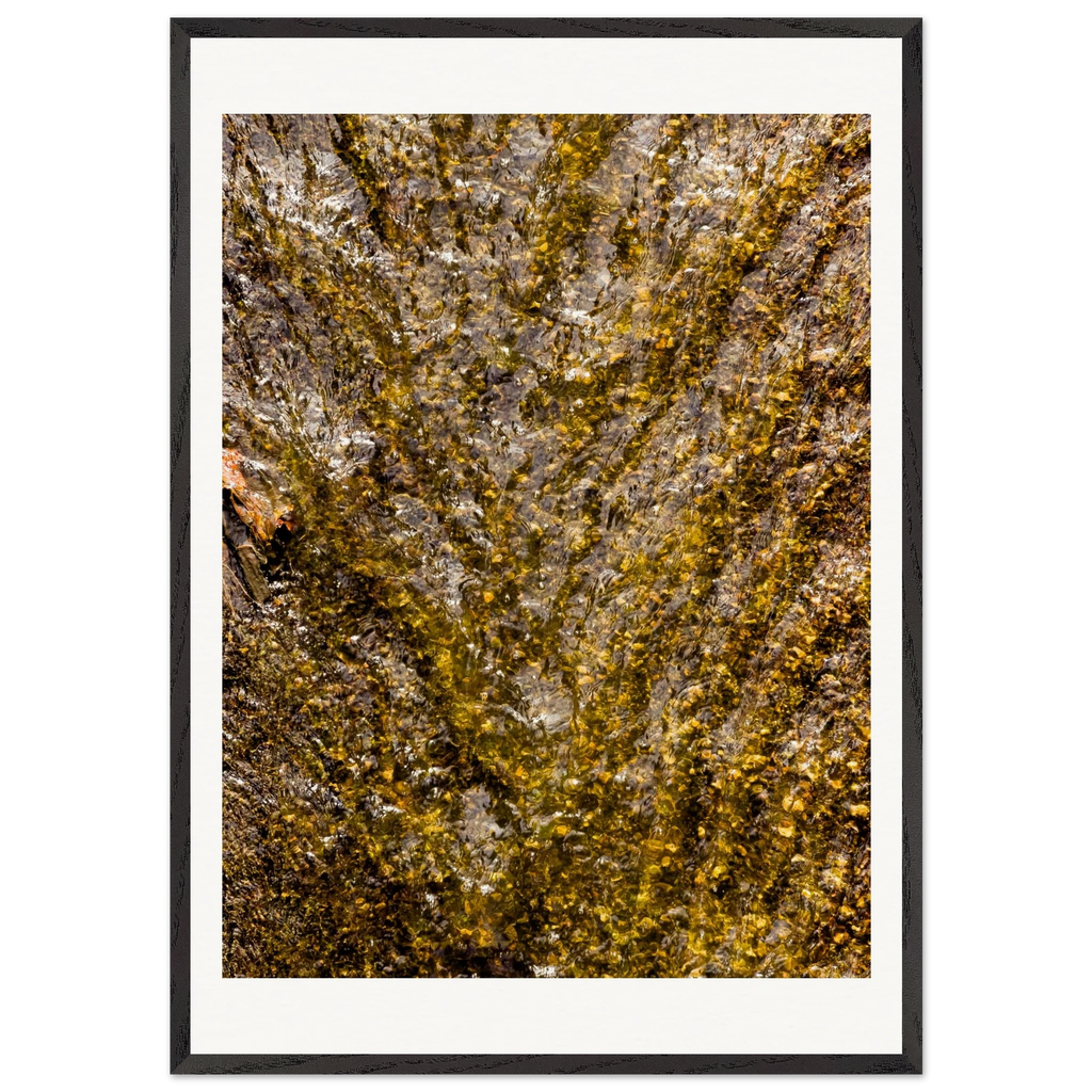 Golden water framed print displayed in modern living room